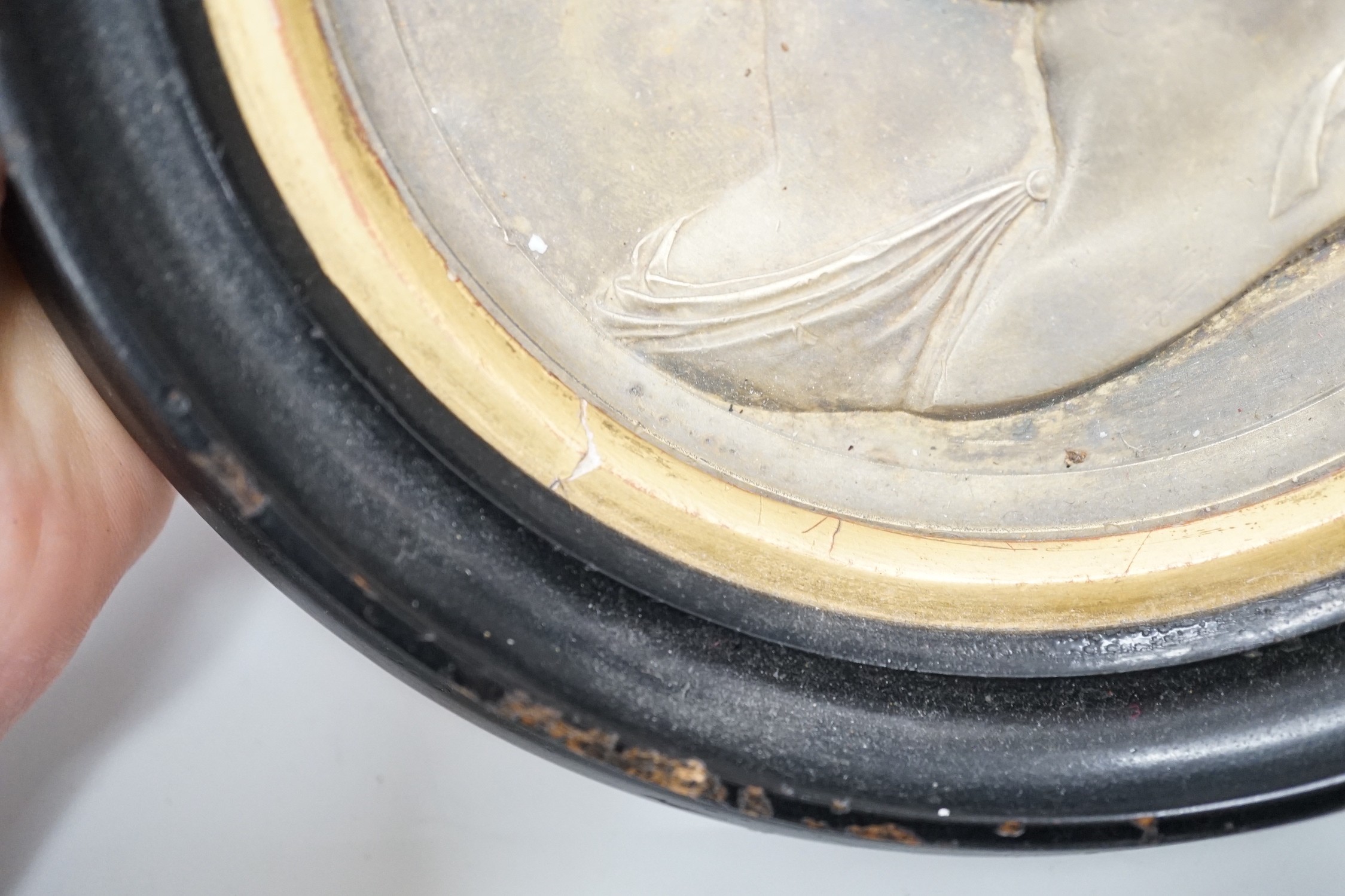 After Bertrand Andrieu (1761-1822). A framed circular gilt brass relief plaque of Napoleon Bonaparte and Marie Louise, Duchess of Parma: signed lower right of bust 'Andrieu Fecit', 14cm diameter excl frame